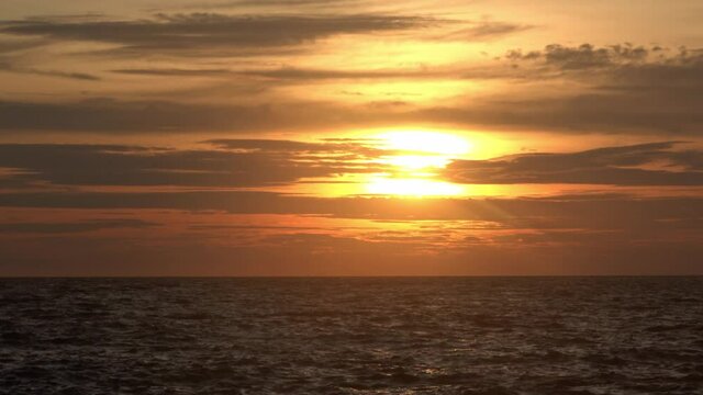 Sunset over the ocean. Filmed at Looc Beach Surigao Philippines. The Surigao Strait.