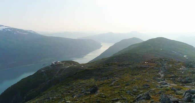 Loen skyline gondol on Norway west mountain top with fjord background - aerial