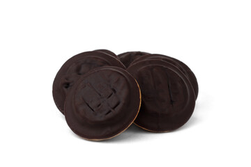 Pile of chocolate biscuit cookies with orange jam isolated on white background.