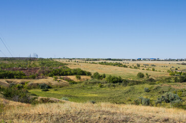 The steppe is woodless. Ravine in the steppe. Forest of the steppe landscape. Forest formation. Poor in moisture. Grass vegetation in the dry climate zone.