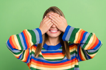 Photo portrait girl shut face with hands smiling playing game childish isolated pastel green color...