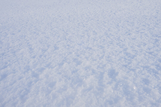 Texture of white snow with frozen ice, background