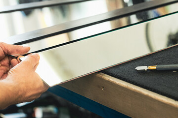 Cutting mirrors in a glass factory