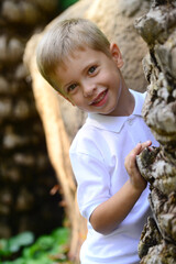 Portrait of young smiling boy in outdoors. - 456779500