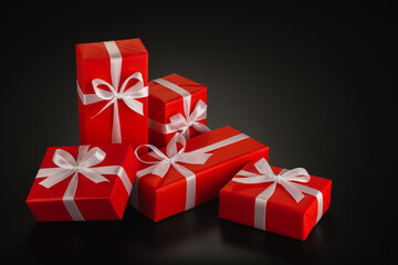 Elegant, stylish gifts in red wrapping paper with white satin bows on a black background. Side view. Perfect retouching. Advertising, banner. Copy space.