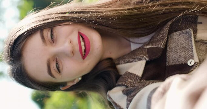 Young girl vlogger waving hand speaking looking at camera webcam. Girl communicating with friend online make video call talking record lifestyle vlog distance job interview