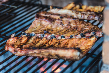 Delicious brown coocked ribs on a grill (barbecue)