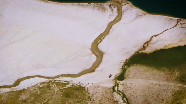 Horseback Riding At Sandy Lakeshore Of Arashan Lake In Namangan, Uzbekistan. - aerial