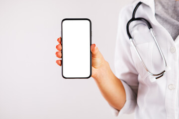 woman doctor showing blank screen of mobile phone. online doctor's consultation