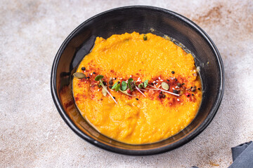 pumpkin cream soup puree fresh portion meal snack on the table copy space food background rustic veggie vegan or vegetarian food