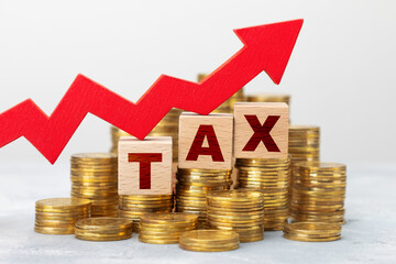 Raising taxes. Red up arrow on the background of gold coins and the inscription TAX