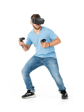 Young Man Playing With A VR Glasses On A White Background