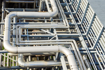 Abstract view of a set of pipelines running through a liquefied gas production plant.