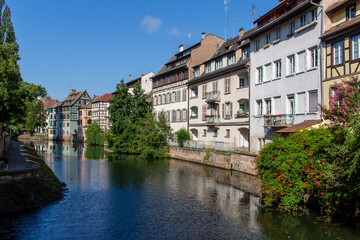 Fototapeta na wymiar Beautiful French and German style traditional half-timber framed homes along the tranquil River Ill in Strasbourg, France