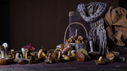 Forest mushrooms lie on a wooden table