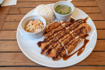 Top view of Lunch menu, Tonkatsu, Deep fried pork with rice, soup and cabbage salad. 