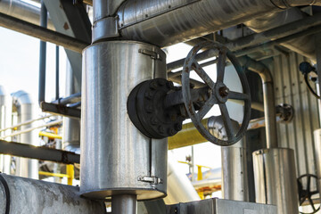 The valve is a gate valve on a metal pipe at a liquefied gas production plant.