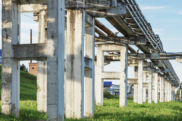 Old white overpasses for holding pipelines.