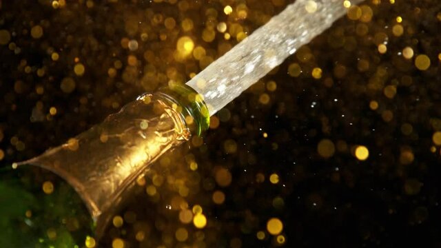 Super slow motion of Champagne explosion with glittering particles. Filmed on high speed cinema camera, 1000fps