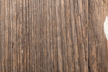 Detail of an old wooden board. Texture and pattern from old dark colored planks. 