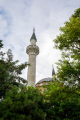 Fototapeta premium Crimea, Evpatoria, August 20, 2021: View of the Juma-Jami (Khan-Jami) mosque among a trees.