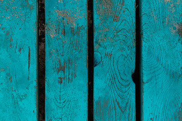 Vintage wooden background. Wooden boards painted blue with scuffs.