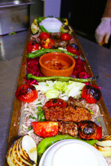 selective focus, kebab plate of mixed Turkish kebabs prepared for interested customers at a special kebab restaurant in Istanbul