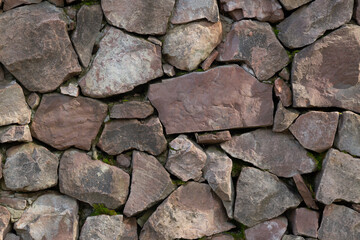 The background of the wall is made of natural stone.
