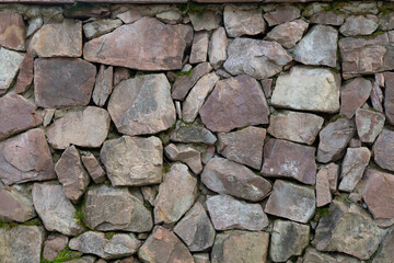 The background of the wall is made of natural stone.