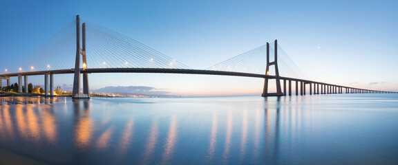 Amazing sunrise in Lisbon, watching the Vasco da Gama Bridge start to light up