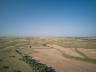 Aerial drone image of Farmland and wind turbines in the state of Kansas