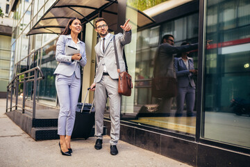 Business people go to business trip. Man pulling his suitcase.