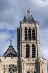Fototapeta na wymiar Facade of Basilica of Saint-Denis (Basilique royale de Saint-Denis, from 1144) - former medieval abbey church in city of Saint-Denis, a northern suburb of Paris. France.