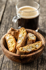 Italian cantuccini cookies and coffee cup. Sweet dried biscuits with almonds