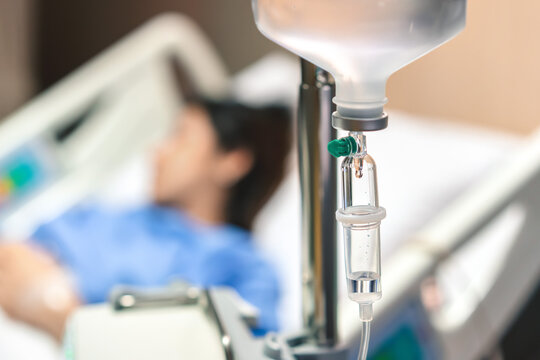 Close up of medical drip or IV drip chamber in patient room, Selective focus, Healthcare concept.