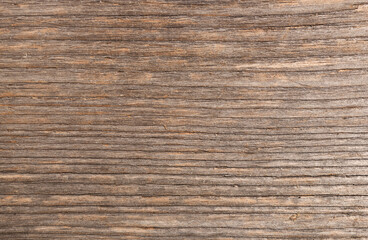 Detail of an old wooden board. Texture and pattern from old dark colored planks. 