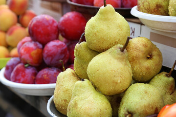 Pears on the local farm market, eco fruits, juicy products. Shopping organic products. Healthy grocery. Autumn season market