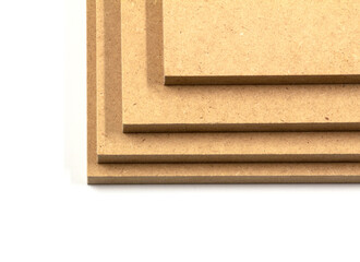 Four boards of raw mdf ready for assembly.