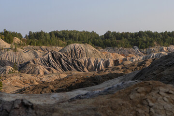 The clay quarry resembles a cosmic landscape.Ural Mars.An original landscape in the Sverdlovsk region in Russia.Top view of the hills made of refractory clay.A unique place created by man and nature