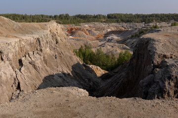 The clay quarry resembles a cosmic landscape.Ural Mars.An original landscape in the Sverdlovsk region in Russia.Top view of the hills made of refractory clay.A unique place created by man and nature