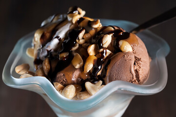 chocolate ice cream with peanuts, caramel and chocolate