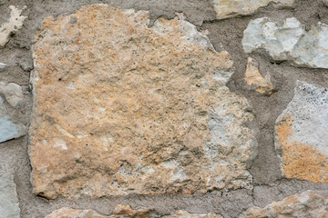 close-uptexture of a stone wall, stone wall background, limestone wall, building exterior