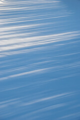 Light and shadow. Background and texture of snow.