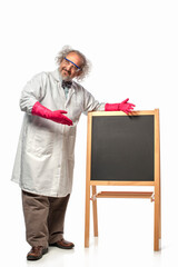 Happy Scientist standing next to a black message board