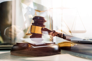 Business and lawyers discussing contract papers with brass scale on desk in office. Law, legal...