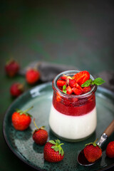Delicious Italian dessert Panna Cotta with fresh summer strawberries