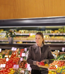 Woman buying vegetables at the market