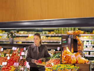 Woman buying vegetables at the market