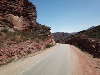 desert road in reddish mountain