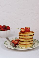 Dairy-free pancakes with strawberry and honey